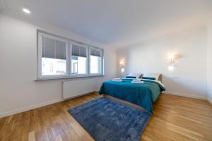 Posteľ alebo postele v izbe v ubytovaní Apartament Nowy Świat Centrum