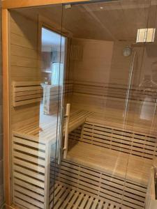a sauna with a glass door in a room at Luxurious 6 bedroom villa In a great location in Chalkida