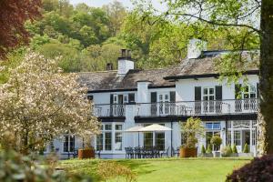 a large white house with a balcony at Rothay Manor Hotel in Ambleside