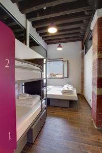 two bunk beds in a room with a window at Generator Venice in Venice