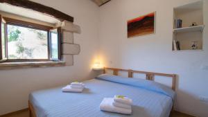 Postel nebo postele na pokoji v ubytování Borgo Majella by Rentbeat + 37 fotografií