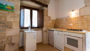 Kuchyň nebo kuchyňský kout v ubytování Borgo Majella by Rentbeat