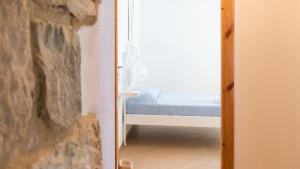 Postel nebo postele na pokoji v ubytování Borgo Majella by Rentbeat