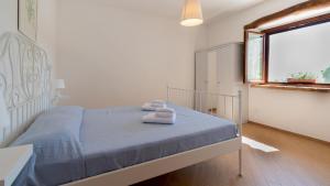 Postel nebo postele na pokoji v ubytování Borgo Majella by Rentbeat