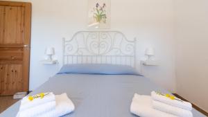 Postel nebo postele na pokoji v ubytování Borgo Majella by Rentbeat