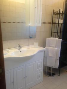 a bathroom with a white sink and a mirror at Le Sirene Bed and Breakfast in Cellamare +86 photos