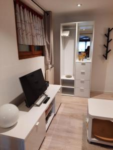 a room with a desk with a computer on it at Chalet Clair de Lune bei Grächen VS in Gasenried