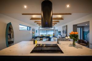 a kitchen with a large island with a counter top at Tides Uig Isle of Skye in Uig