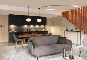 a living room with a couch and a table at Maison Albar Hotels L’Imperator in Nîmes