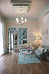 a living room with a couch and a table at Hotel Flora in Cattolica