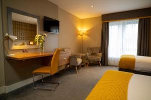 Łóżko lub łóżka w pokoju w obiekcie Hotel Doolin
