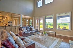 a living room with a couch and a table at Blue Ridge Home with Game Room 14 Mi to McKinney! in Blue Ridge