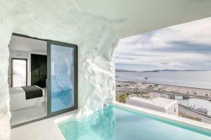 a room with a view of the ocean at Tagoo Black Mykonos in Mýkonos City
