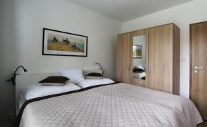Posteľ alebo postele v izbe v ubytovaní Apartmán Valérie, byt Valtice