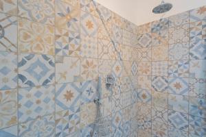Koupelna v ubytování Acqua Chiara Apartment by Rent All Como