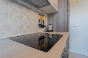 Nápoje v ubytování Acqua Chiara Apartment by Rent All Como
