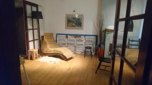a living room with a couch and a chair at Domek w górach do wynajęcia i pokoje in Piwniczna-Zdrój