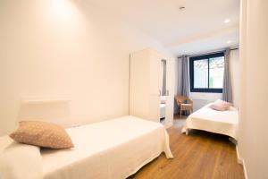 Apartaments Voralmar客房内的一张或多张床位