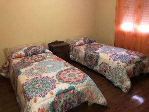 Postelja oz. postelje v sobi nastanitve Casa Rural Mirador de Quintana
