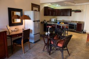 A kitchen or kitchenette at Swiss Inn Plaza Hotel