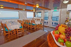 a dining room on a cruise ship with a plate of fruit at Cruise Ship Southern Star At Dock Only in Bahía de Caráquez