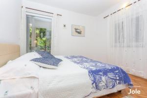 Postel nebo postele na pokoji v ubytování Apartmani Bego