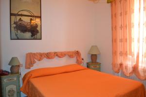 A bed or beds in a room at Hotel Roma