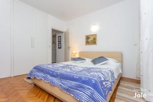 Postel nebo postele na pokoji v ubytování Apartmani Bego