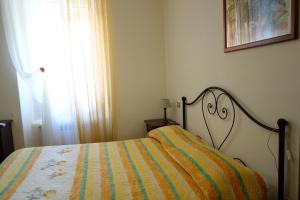 A bed or beds in a room at Hotel Roma