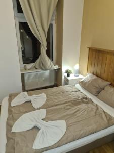 Ein Bett oder Betten in einem Zimmer der Unterkunft Hotel hostel Zafir