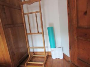 a wooden ladder leaning against a wall next to a door at Home with the veranda (B&B) free parking in Veliko Tŭrnovo