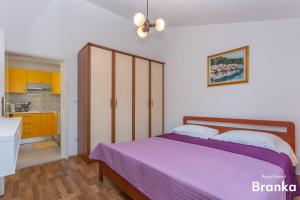Postel nebo postele na pokoji v ubytování Apartmani Bego