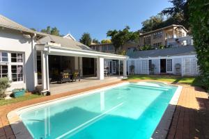 a swimming pool in the backyard of a house at Taunton Manor in Pietermaritzburg