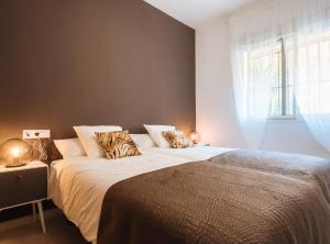 Posteľ alebo postele v izbe v ubytovaní Sol Suite Apartment with Garden + 6 fotografií