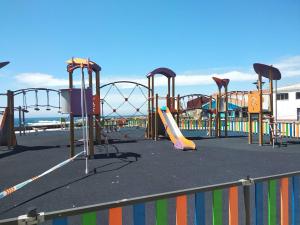 an empty playground with a slide and a slidesktop at Fonte do Cabo in Muxia