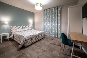 מיטה או מיטות בחדר ב-La Casa Tra Gli Ulivi