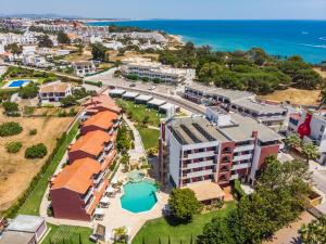 an aerial view of a resort near the ocean at Topazio Vibe Beach Hotel & Apartments - Adults Friendly in Albufeira