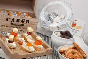 a table with a box of crackers and a box of snacks at Casual Socarrat Valencia - Adults Only in Valencia