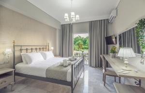 Postel nebo postele na pokoji v ubytování Erofili Hotel + 37 fotografií