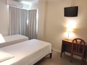 Postel nebo postele na pokoji v ubytování Hotel Sao Mamede Estoril