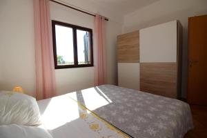 Posteľ alebo postele v izbe v ubytovaní Apartment Liliana near beach