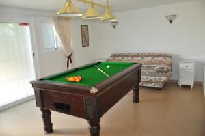 a living room with a pool table and a couch at 2021 PRICES!! FAMILY VILLA BY MARINA private pool heating optional, snooker in Benalmádena
