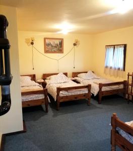 Postel nebo postele na pokoji v ubytování Brvnara Ljubičica