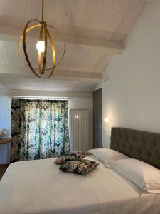 A bed or beds in a room at AFFITTACAMERE LA VOLPE