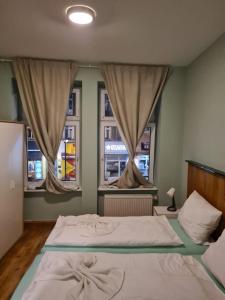 Postel nebo postele na pokoji v ubytování Hotel hostel Zafir