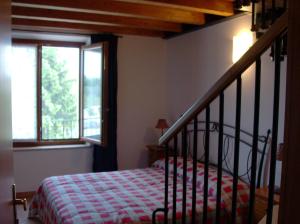 A bed or beds in a room at Agriturismo La Palazzina