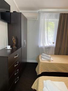 Łóżko lub łóżka w pokoju w obiekcie Tennis Academy Hotel