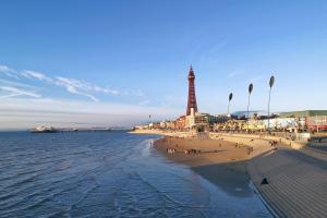 a view of a beach with the eiffel tower at White Moon Hotel in Blackpool