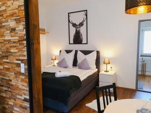 Postel nebo postele na pokoji v ubytování Kozma Apartments Peterlewand Gerlitzen Ossiachersee