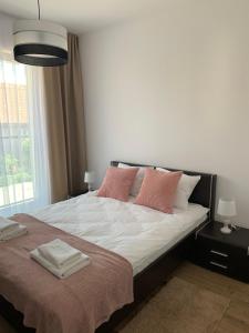 Łóżko lub łóżka w pokoju w obiekcie Apartament Joanna